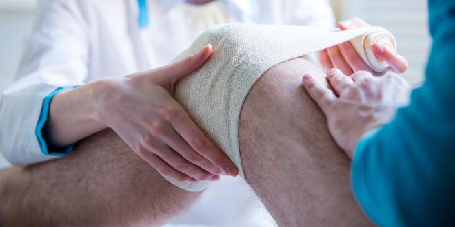 Kniescheibenluxation Bandage bei einer Kniescheibenluxation